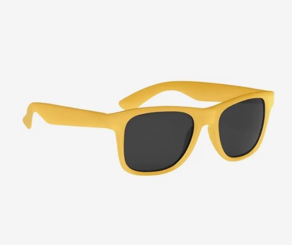 A photo of a pair of plastic sunglasses turning light orange.