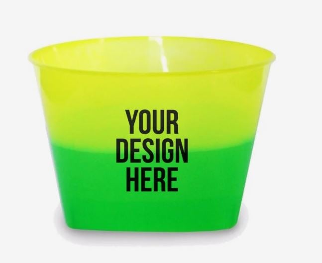 A photo of a plastic bowl changing from yellow to green, with YOUR DESIGN HERE printed on it.