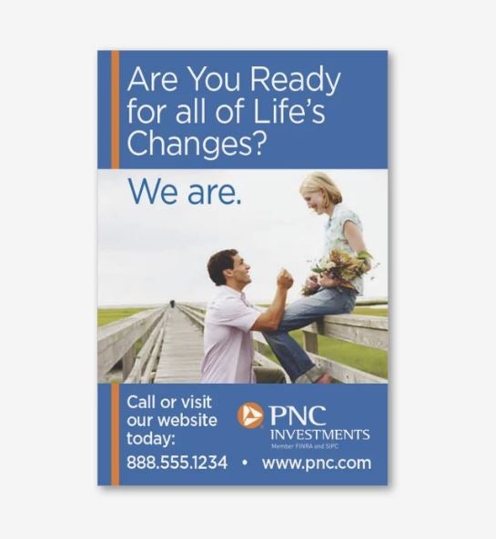 A photo showing a rectangular magnet in a portrait orientation with an advert for PNC. It shows a woman sitting on a wooden fence holding flowers, while a man stands in front of her holding up a ring. The text says Are You Ready for all of Life's Changes? We are. And then some contact info.