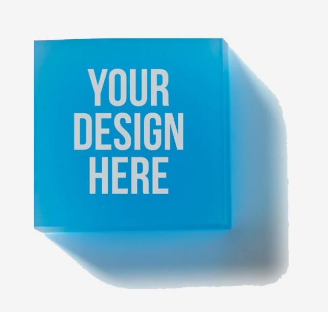 A photo showing a square light blue eraser printed with YOUR DESIGN HERE in white.