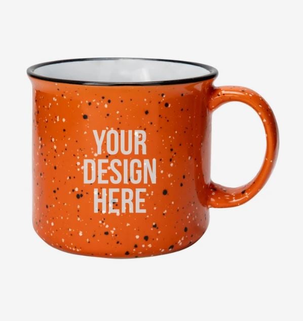 A photo of a speckle orange campfire mug with YOUR DESIGN HERE printed on it.
