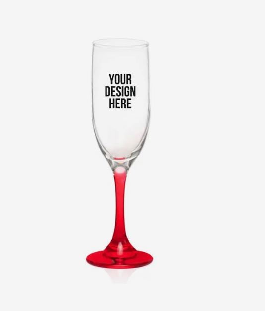 A photo of a flute-shaped glass with a red stem and with YOUR DESIGN HERE printed on it.