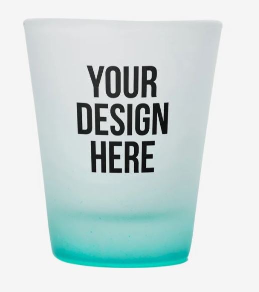 A photo of a frosted shot glass and blue bottom, and with YOUR DESIGN HERE printed on it.