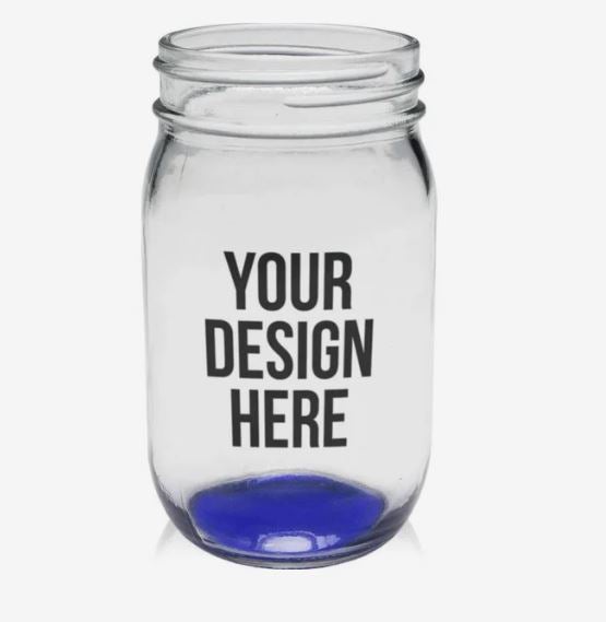 A photo of a mason jar with a blue bottom and with YOUR DESIGN HERE printed on it.