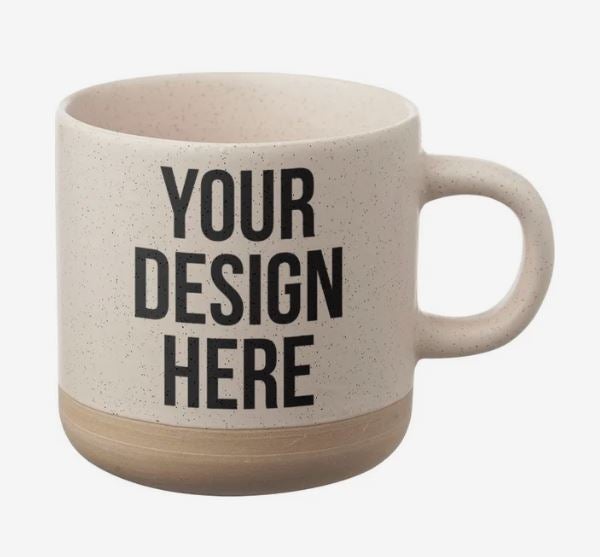 A photo of a speckled brown mug with a darker brown bottom, and with YOUR DESIGN HERE printed on it.