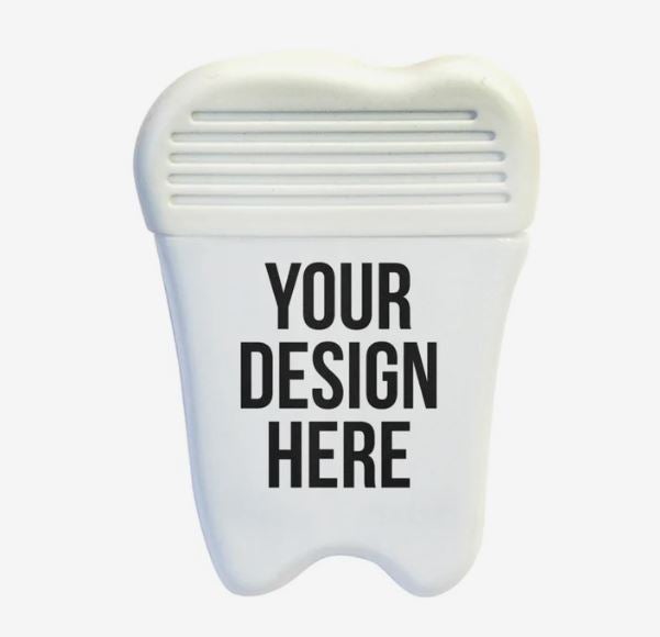 A photo of a plastic magnetic clip shaped like a tooth.
