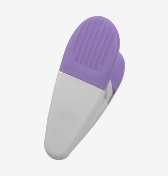 A photo of a purple and white plastic clip.