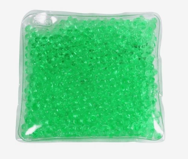 A photo of a square green gel bead hot/cold pack.
