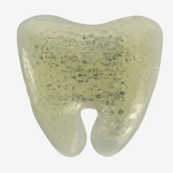 A photo of a white tooth-shaped gel bead hot/cold pack.