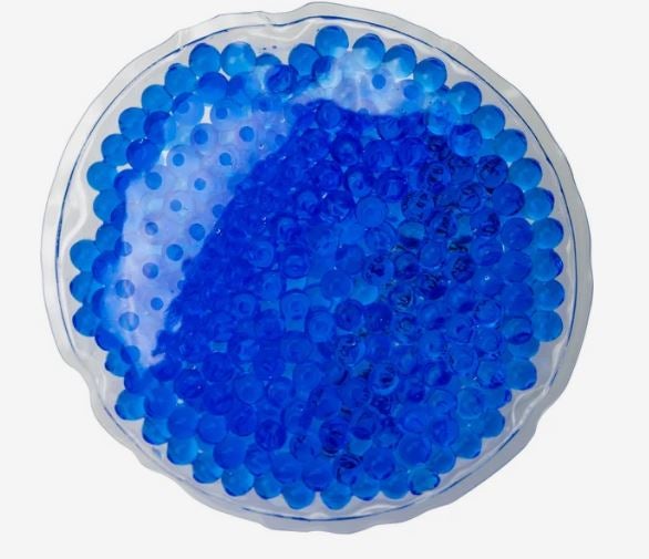 A photo of a circle blue gel bead hot/cold pack.