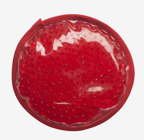 A photo of a red circle gel bead hot/cold pack.