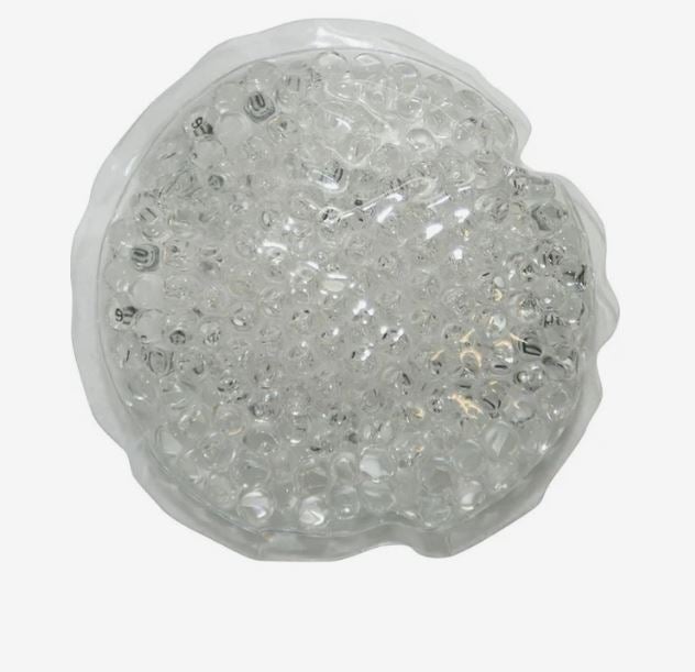 A photo of a white circle gel bead hot/cold pack.