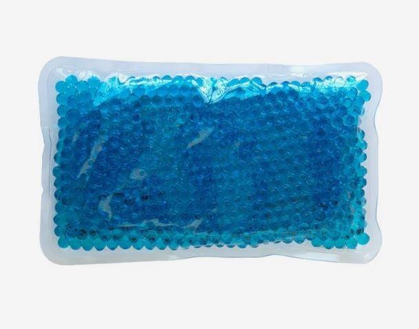 A photo of a blue rectangular gel bead hot/cold pack.