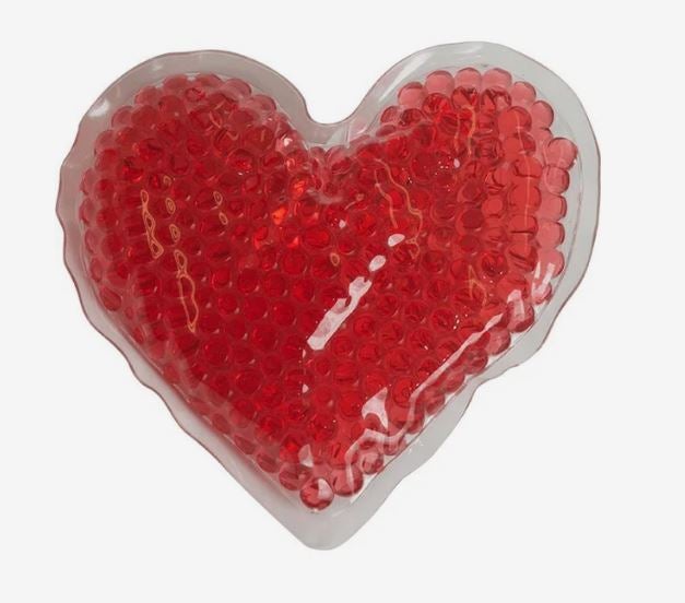 A photo of a red heart-shaped gel bead hot/cold pack.