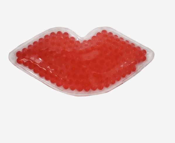 A photo of a hot/cold pack shaped like a red lips.