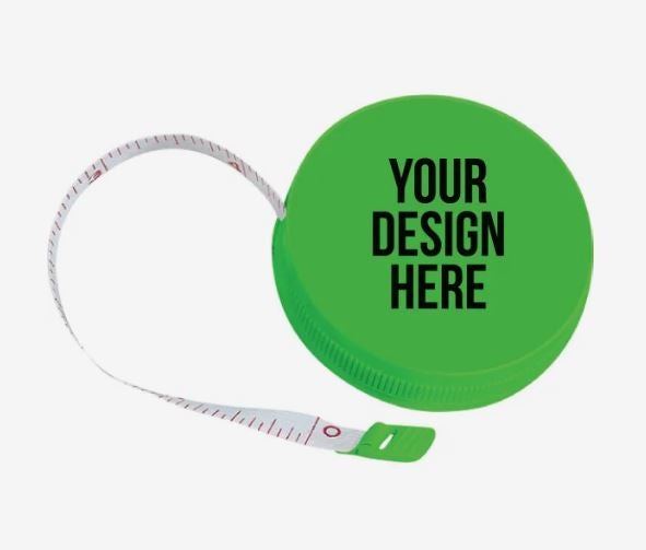 A photo of a round green plastic tape measure with YOUR DESIGN HERE printed on it in black.