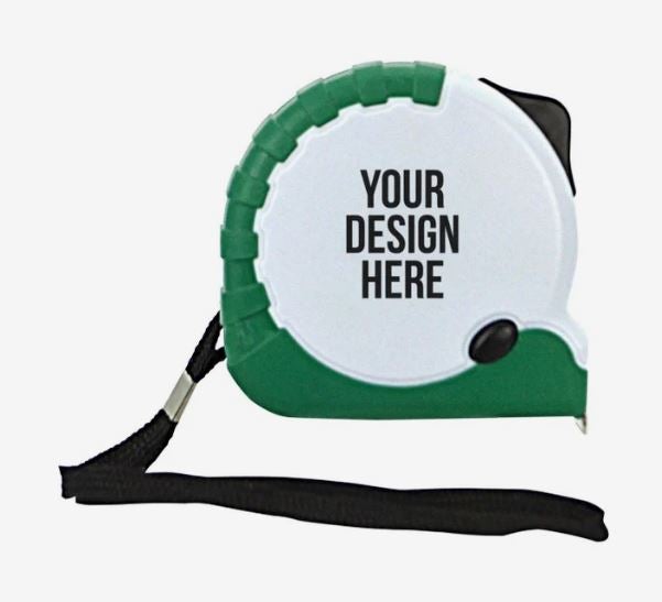 A photo of a green and white tape measure with a black wrist strap and YOUR DESIGN HERE printed on it in black.