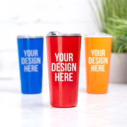 A photo showing three tumblers, in blue, red, and orange, with YOUR DESIGN HERE printed on the front of each in white.