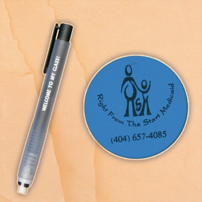 A collage with a background that looks like a wooden desk. On the left is a plastic tube with a white eraser core and white writing on the side. On the right is a round blue eraser with a logo in black printed on it.