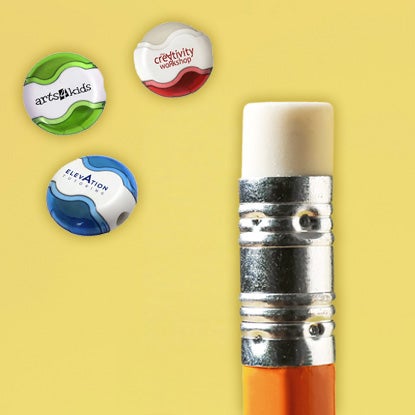 A collage on a yellow background, showing three pencil sharpeners (blue, red, and green) with erasers attached, and a close-up of a white eraser at the end of an orange pencil.