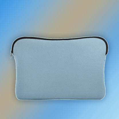 A photo of blue laptop sleeve with a black zip, against a pink and blue background.