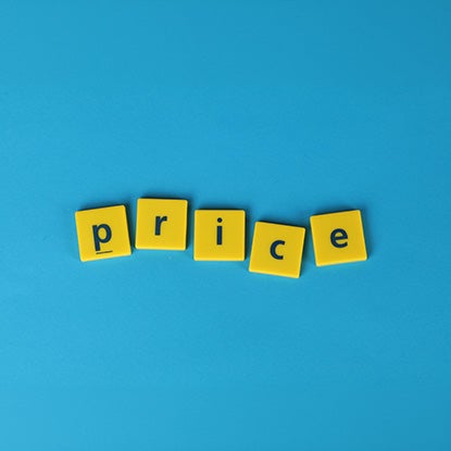 A photo showing plastic yellow squares on a blue background, printed with letters that spell out the word price.
