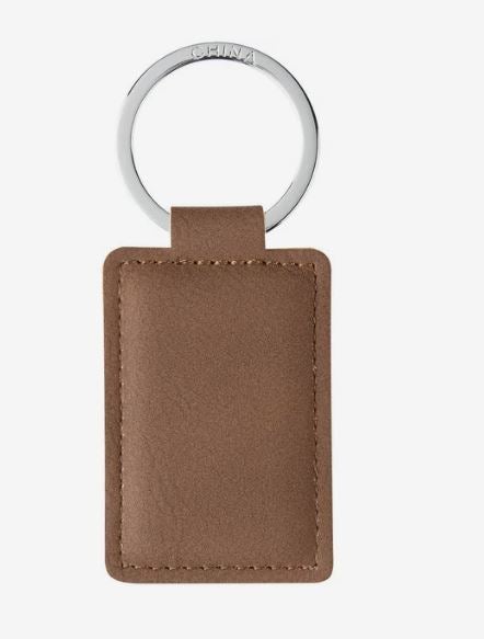 Brown rectangular faux leather keychain with stitched edges and a large silver metal key ring.