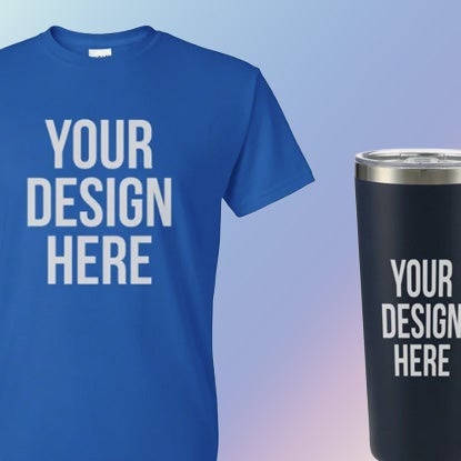 Blue crew neck T-shirt and navy blue travel tumbler with stainless steel rim, both featuring the words 'YOUR DESIGN HERE' in large white capital letters against a light blue gradient background.