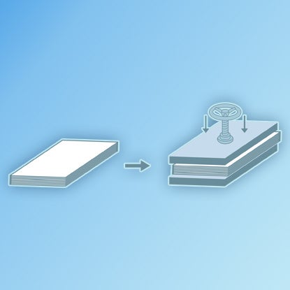 An illustration showing the finished notebook being pressed.