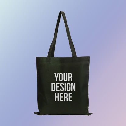 A photo of a black tote bag with YOUR DESIGN HERE printed on it.