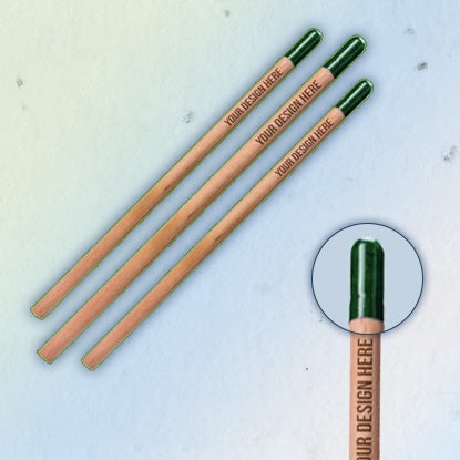 A photo showing three brown pencils with green ends, and a zoomed in close-up showing one green end.