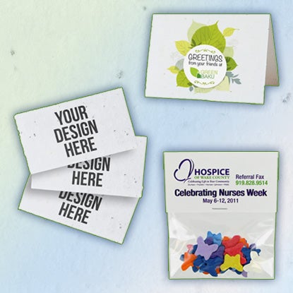 A collage photo showing seeded products, including a greeting card, confetti shaped like butterflies, and business cards printed with YOUR DESIGN HERE.