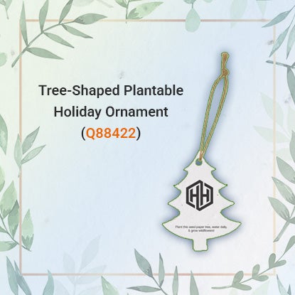 A photo of a tree-shaped seeded paper ornament with a brown string.