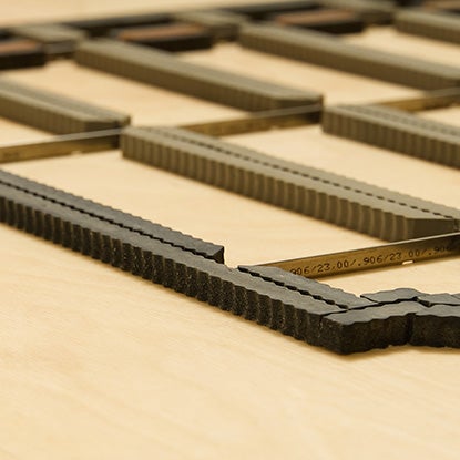 A photo showing a flatbed die cutter.